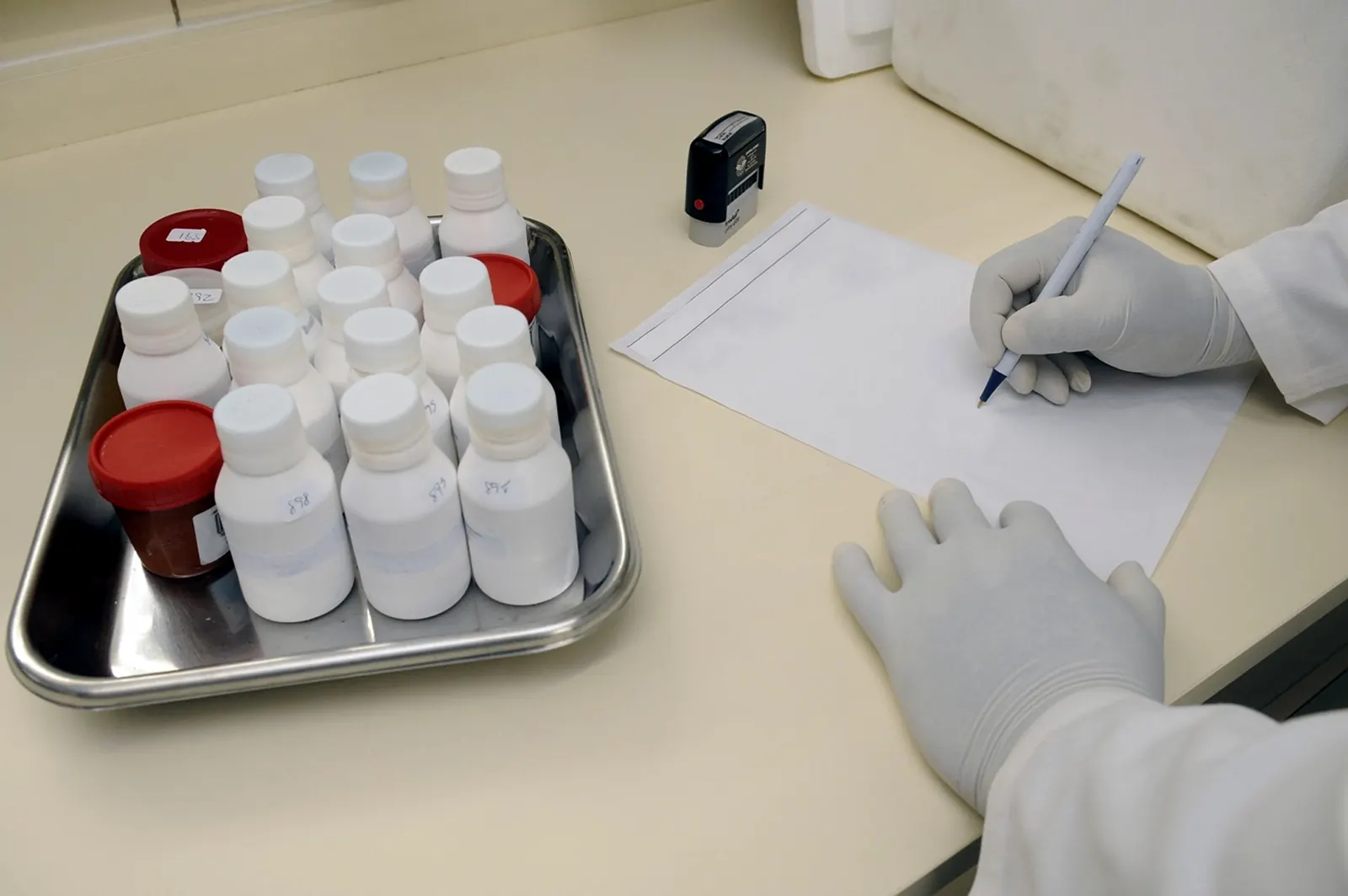 Laboratory technician documenting samples