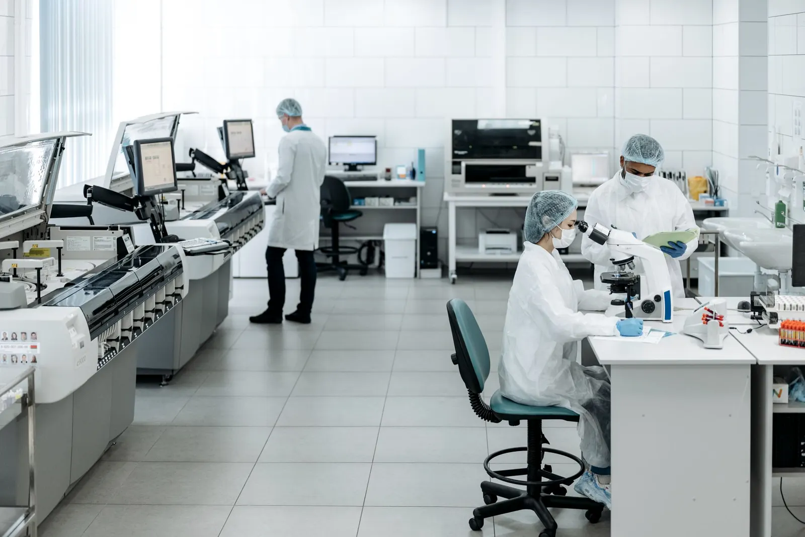 Scientists working with instruments in a modern laboratory